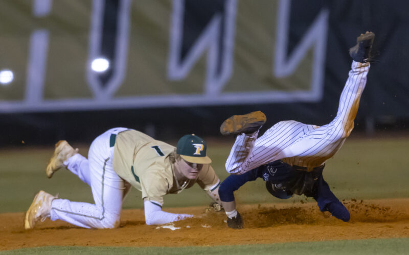 Pinecrest senior Dylan Floyd scrambles to second base to force a Lee County runner in a bizarre play that saw a sharply hit ball ricochet off the third base bag directly to Floyd at short. He got the force out and the Patriots went on to beat the Yellow Jackets 3-2 at home on March 26. David Sinclair for North State Journal
