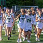 Audrey Kilgore (3), Sam Lineback (30) and the rest of Pinecrest’s girls’ lacrosse team leaves the field after a 12-11 win over Laney to advance in the playoffs. David Sinclair
