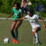 Diana Maria (14), shown here making a move against Woods Charter this season, was named to the Mid-Carolina Conference first team. (Gene Galin)