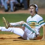 Colby Wallace celebrates after scoring a walk-off run in the playoffs during his junior year at Pinecrest (David Sinclair)