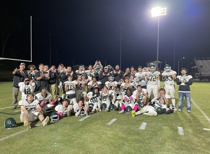 After winning and spoiling Seaforth’s homecoming, North Moore posed for a team photo on the Hawks’ field before heading back home. (North Moore Mustangs’ Twitter/X account)