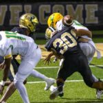 Pinecrest senior defensive back Donovan Brown (30) knocks the ball loose with a big hit on defense. The Patriots had 10 tackles for loss, but it wasn’t enough in a loss to Richmond. (David Sinclair for North State Journal)