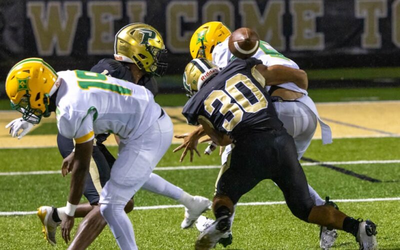 Pinecrest senior defensive back Donovan Brown (30) knocks the ball loose with a big hit on defense. The Patriots had 10 tackles for loss, but it wasn’t enough in a loss to Richmond. (David Sinclair for North State Journal)