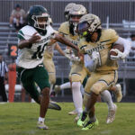 North Moore junior defensive back Justin Walker (10) tries to get a stop on Northwood’s Raje Torres during Friday’s game. Walker finished with five tackles, two tackles for loss and a pass defense in the Mustangs’ loss. (Gene Galin for North State Journal)